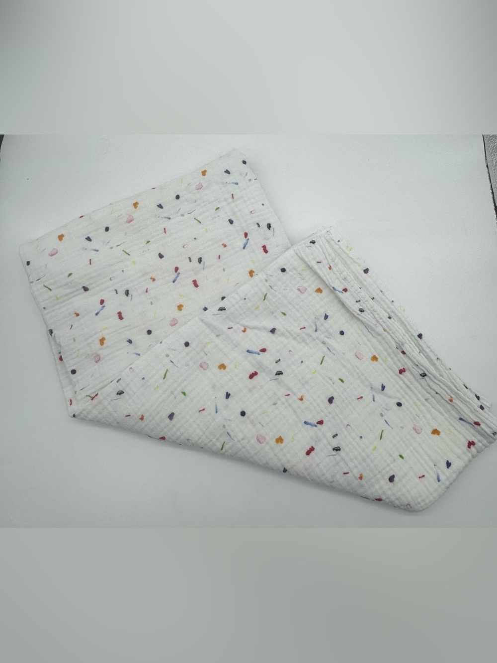 Lovevery Muslin Swaddle Blanket featuring Confetti Style Print